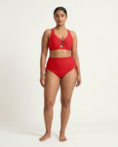 Model wearing the Sculpt Ring Two-Piece Swim Set in scarlet, front view on a clean studio backdrop