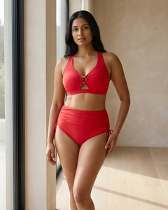 Scarlet two-piece swim set worn poolside at a resort in warm daylight